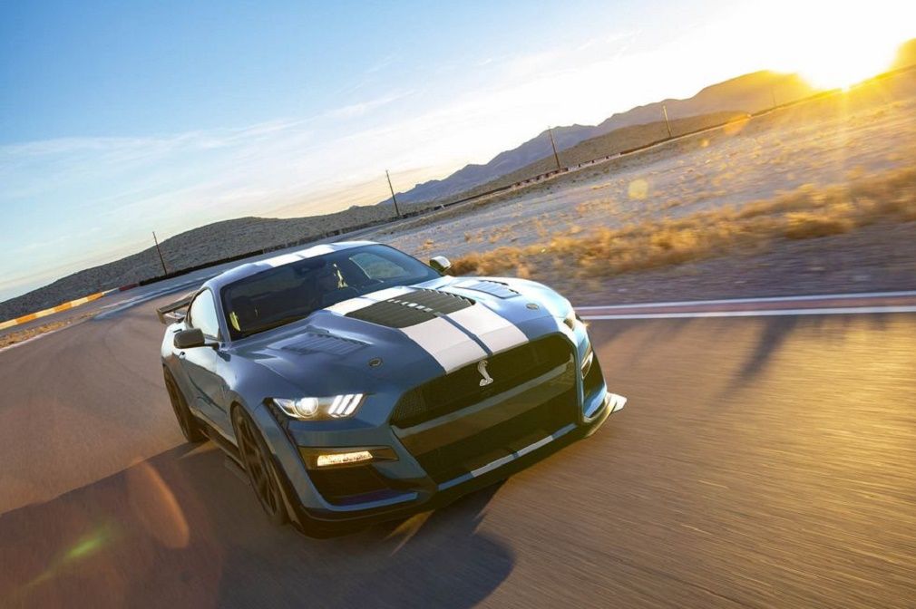 Performance blue 2020 Shelby GT500SE cruising the track at sunset