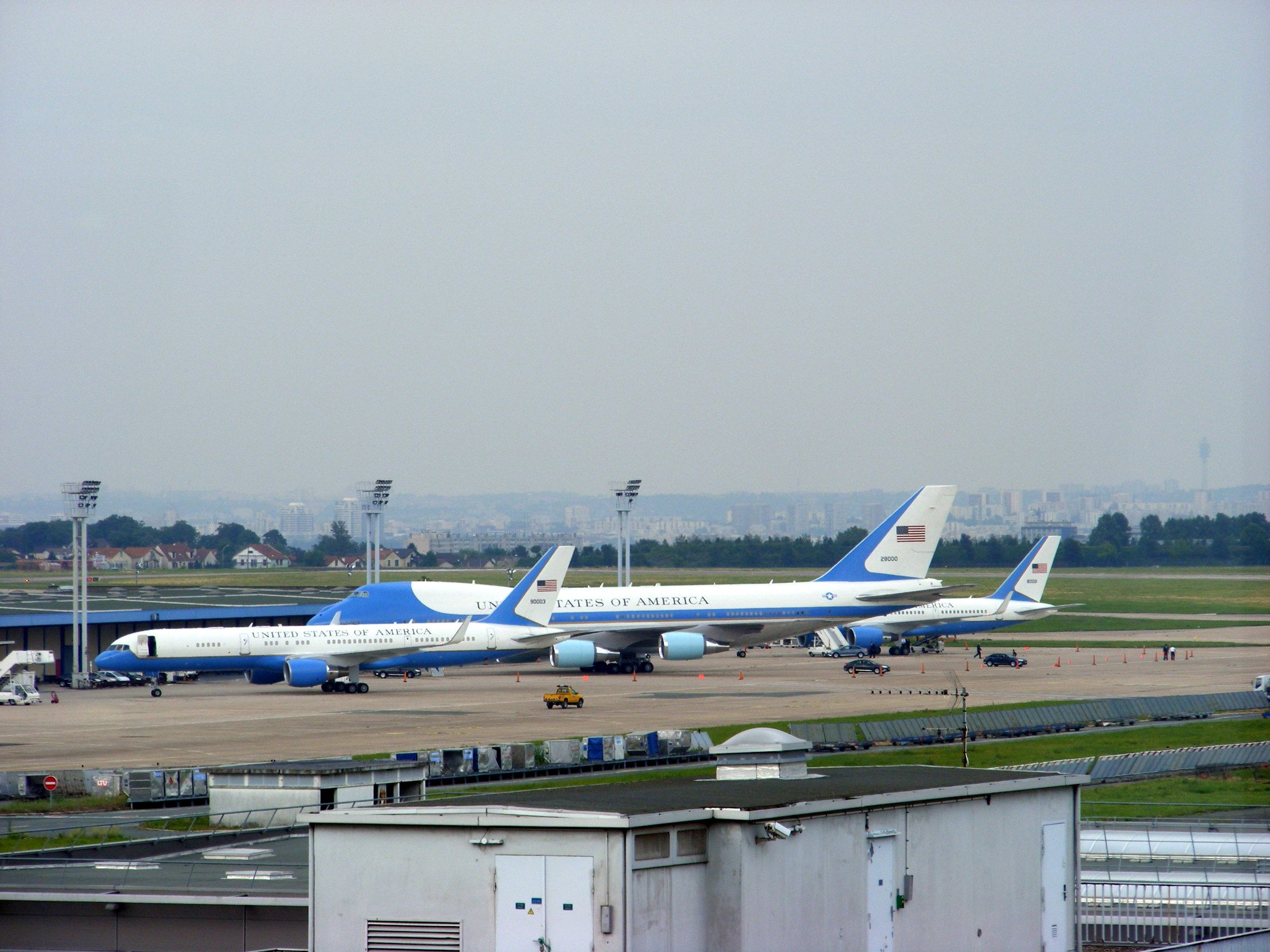 two blue and white planes parked