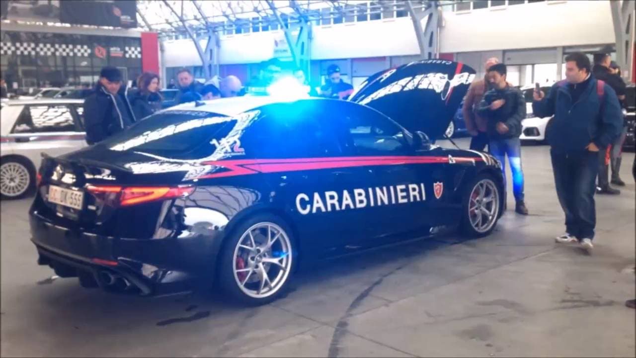 Dark blue Alfa Romeo Giulia Quadrifoglio police car with its hood up