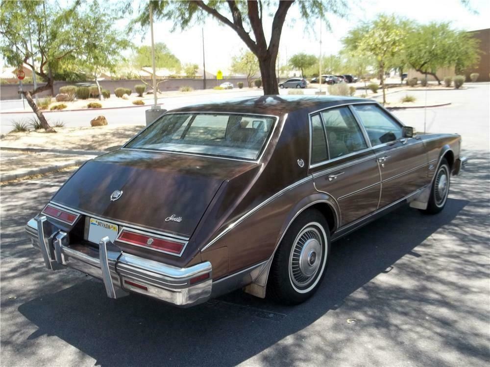 3/4 rear view of a brown second-gen Cadillac Seville