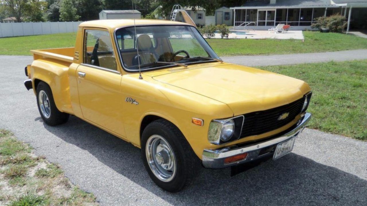 yellow Chevy Luv in driveway