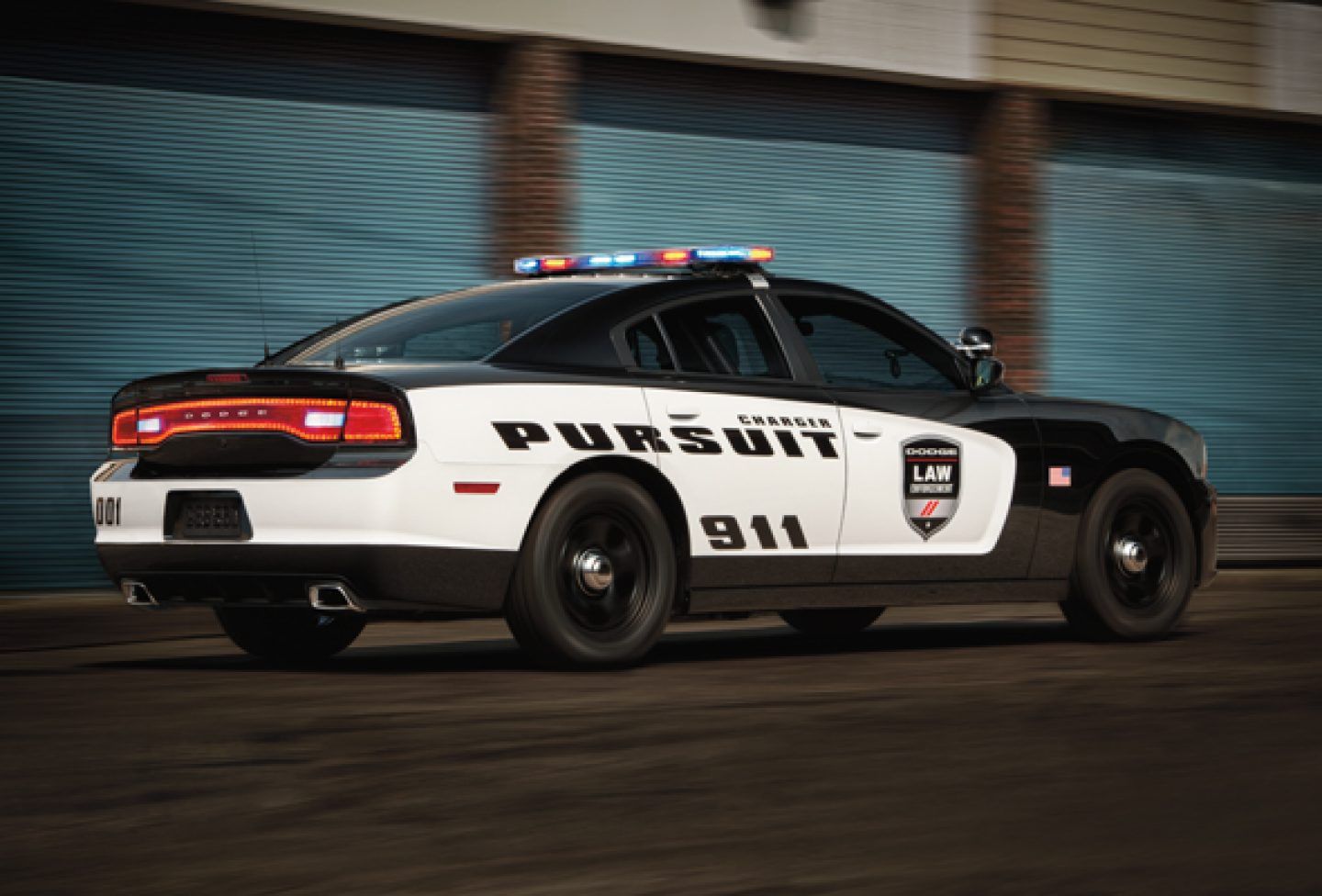 Black and White Dodge Charger Pursuit police car while serving