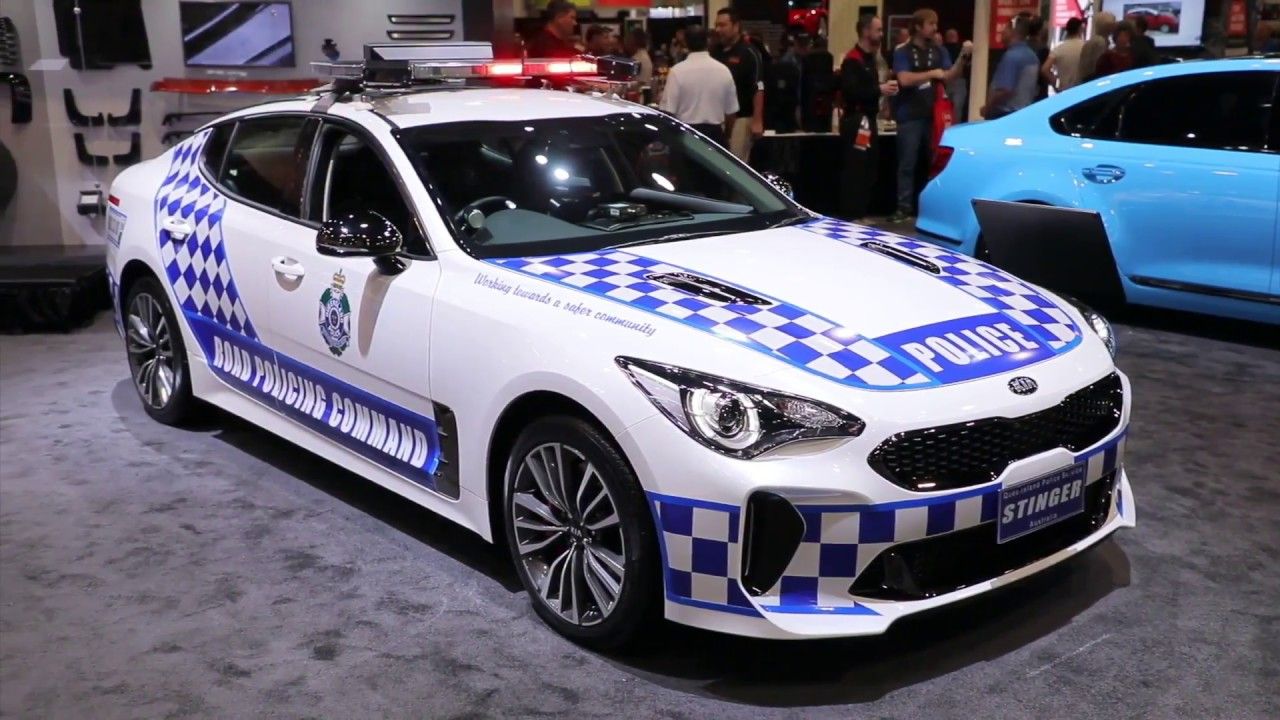 White patrol Kia Stinger GT police car at a car exhibition