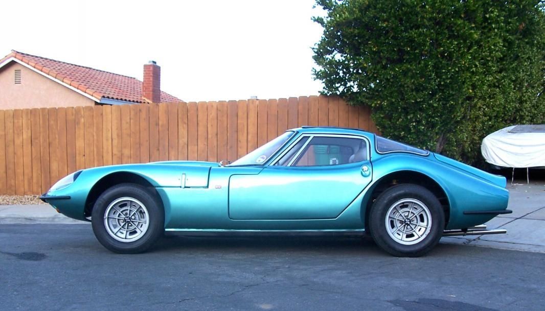 Side view of a Light Blue Marcos GT on the driveway