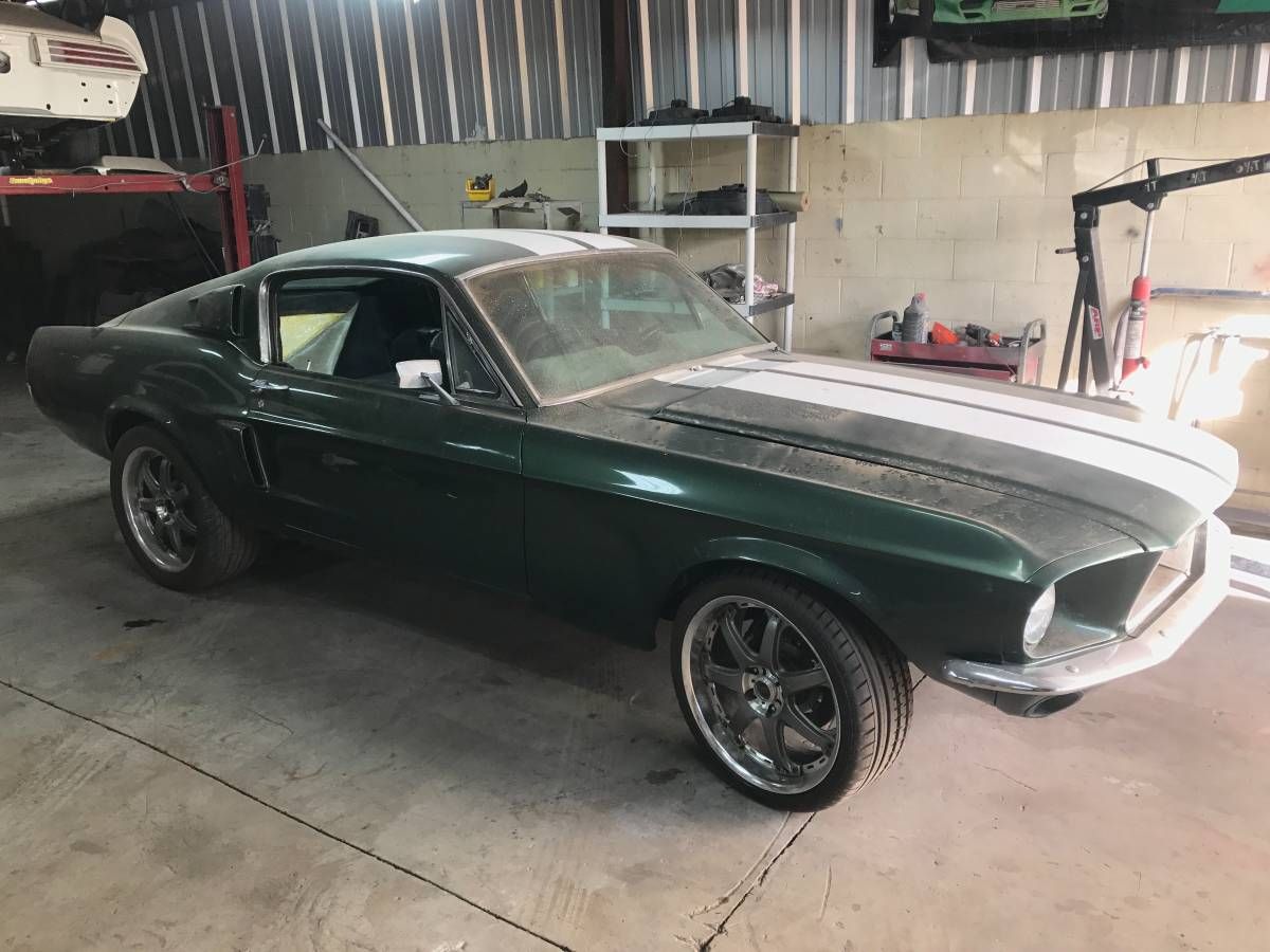 Mustang inside garage with aluminum paneling