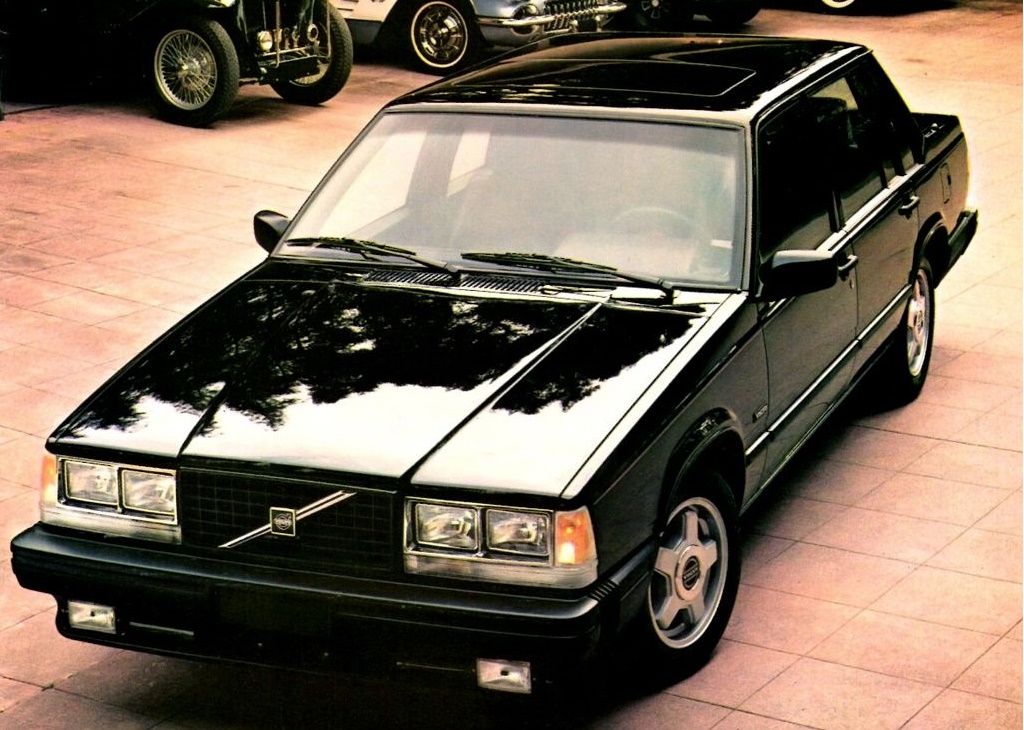 Black Volvo 740 Turbo in a classic car gallery