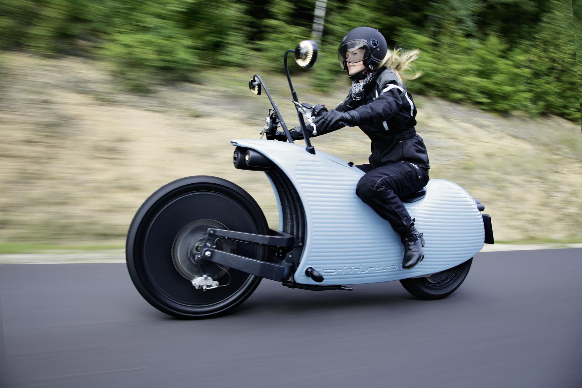 Female motorcycle rider on the Johammer J1 electric motorcycle.