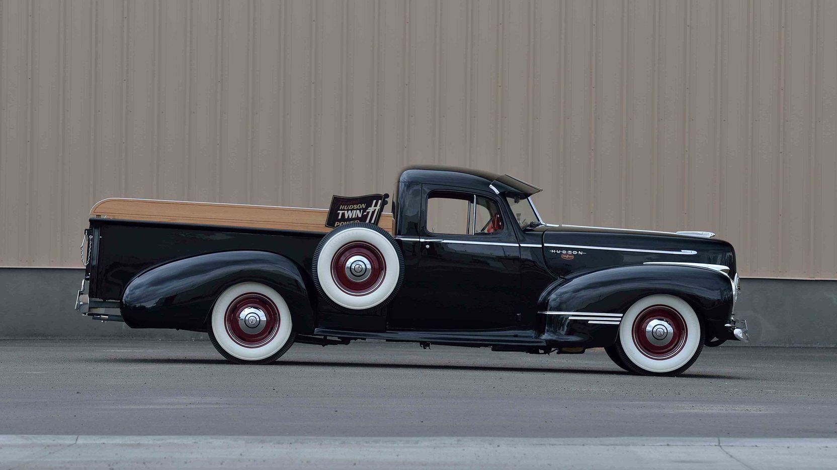 Black 1946 Hudson Pickup on the tarmac next to a wall