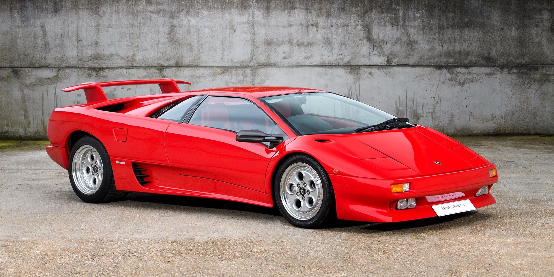 A parked picture of a splendid red 1990 Lamborghini Diablo