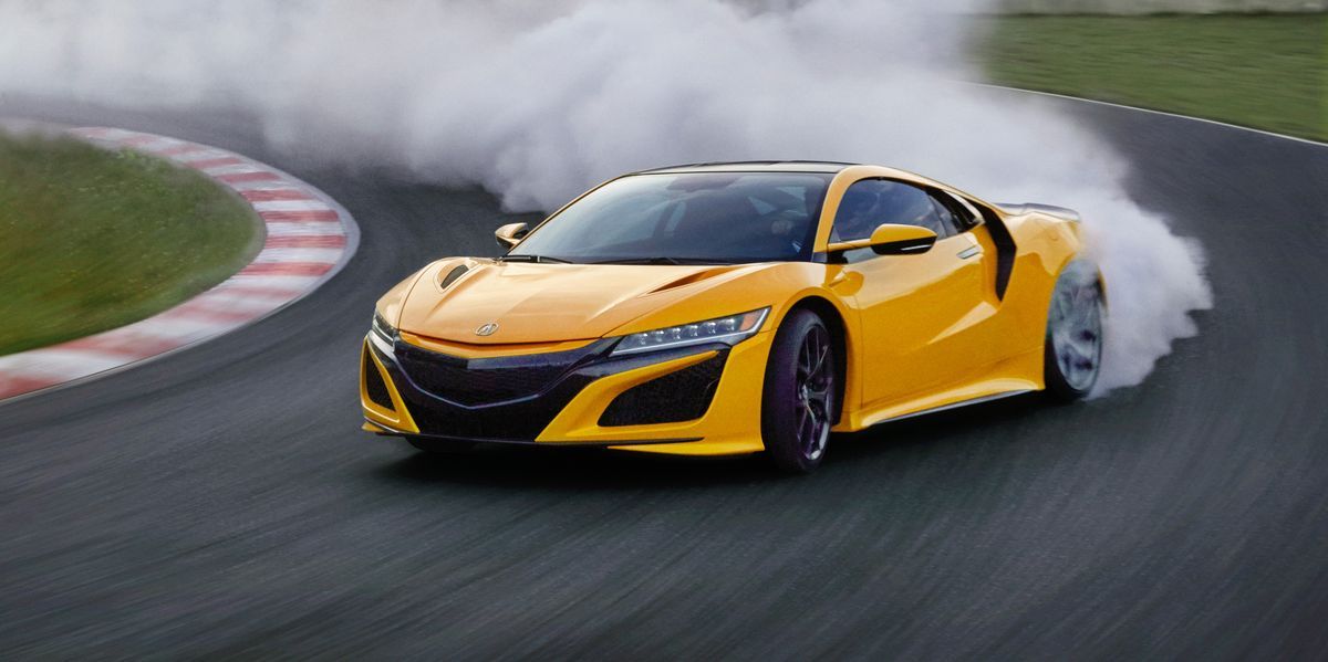 Indy Yellow Pearl Acura NSX while drifting on the track