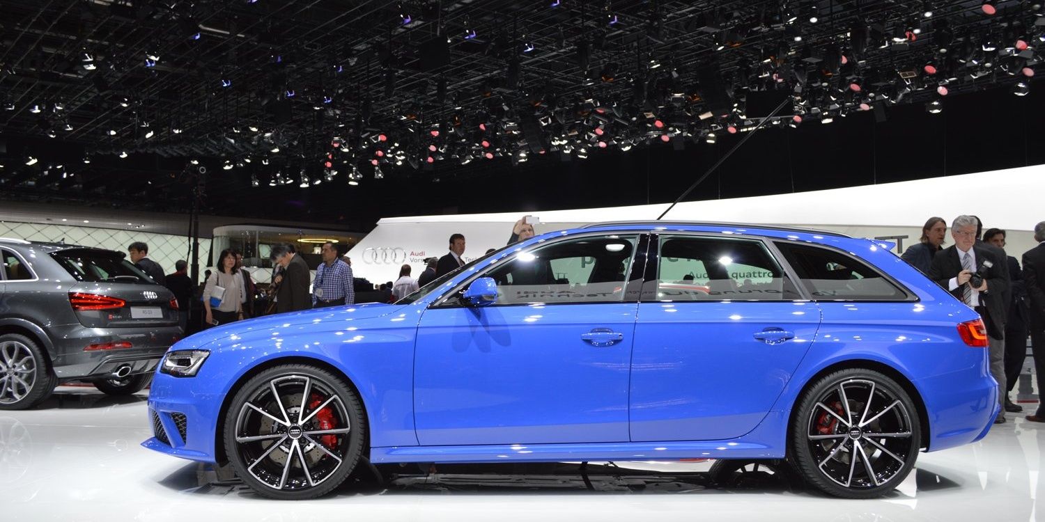 A blue 2014 Audi RS4 Avant Nogaro showcased in a car expo