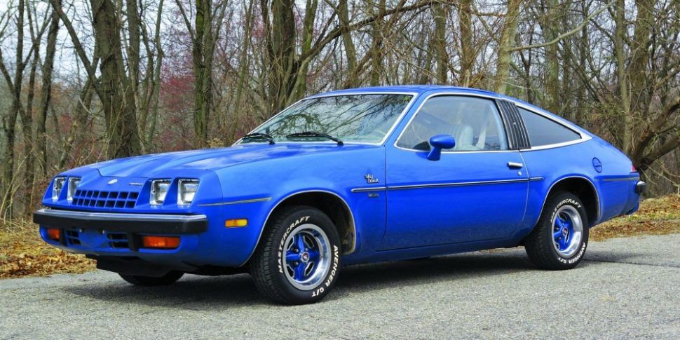 blue 1978 Buick Skyhawk in front of trees