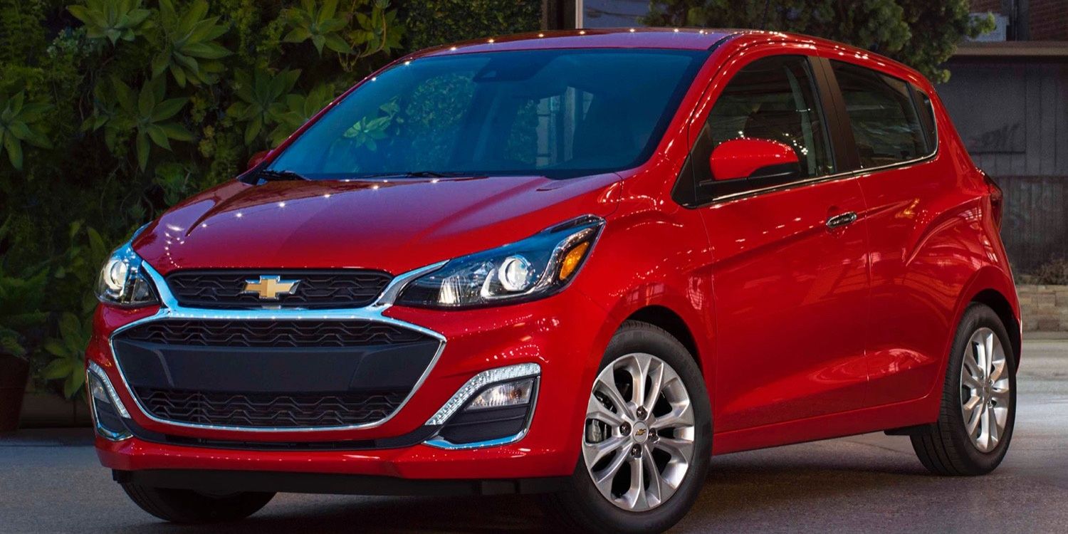 A red 2021 Chevrolet Spark parked