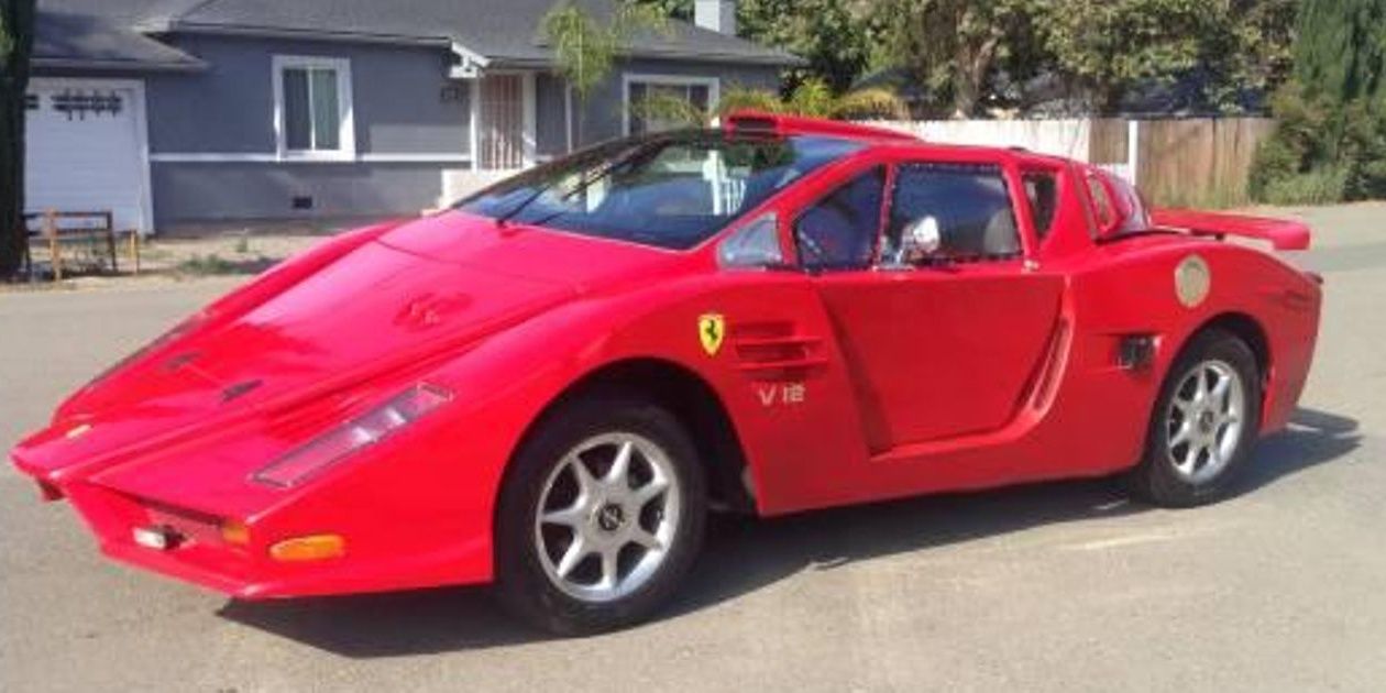 A parked red Pontiac Fiero transformed into a Enzo