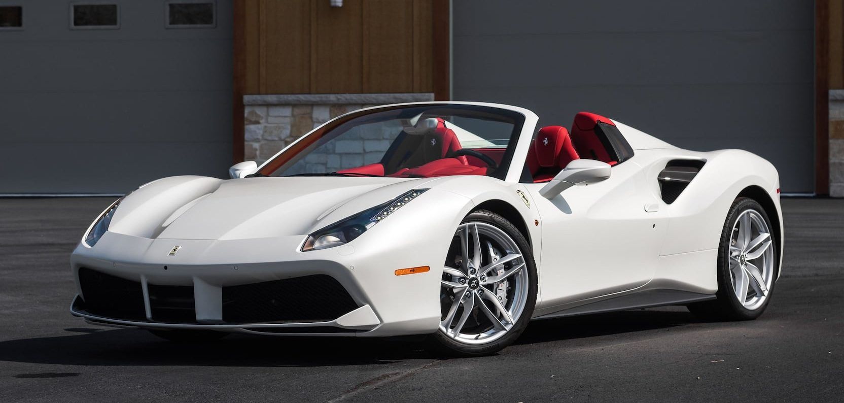 White Ferrari 488 Spider, mostly front view