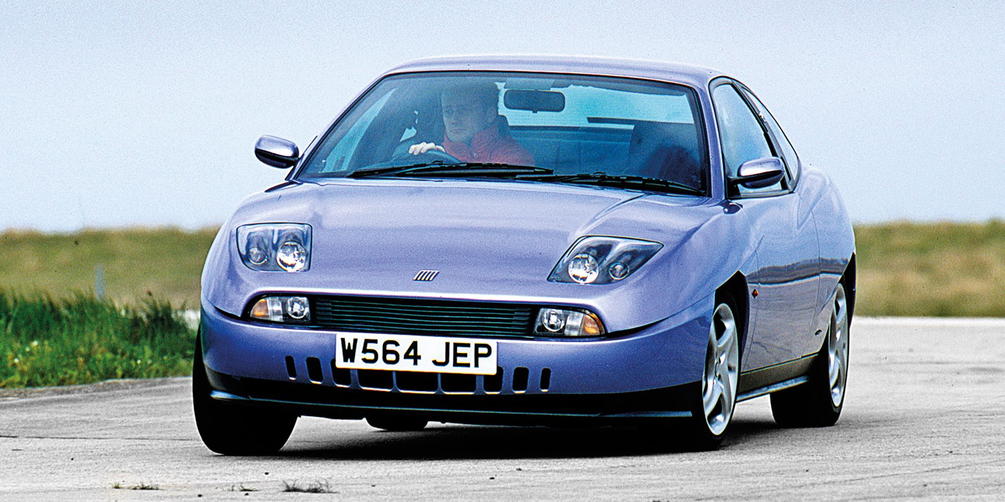 A Fiat Coupe cornering hard