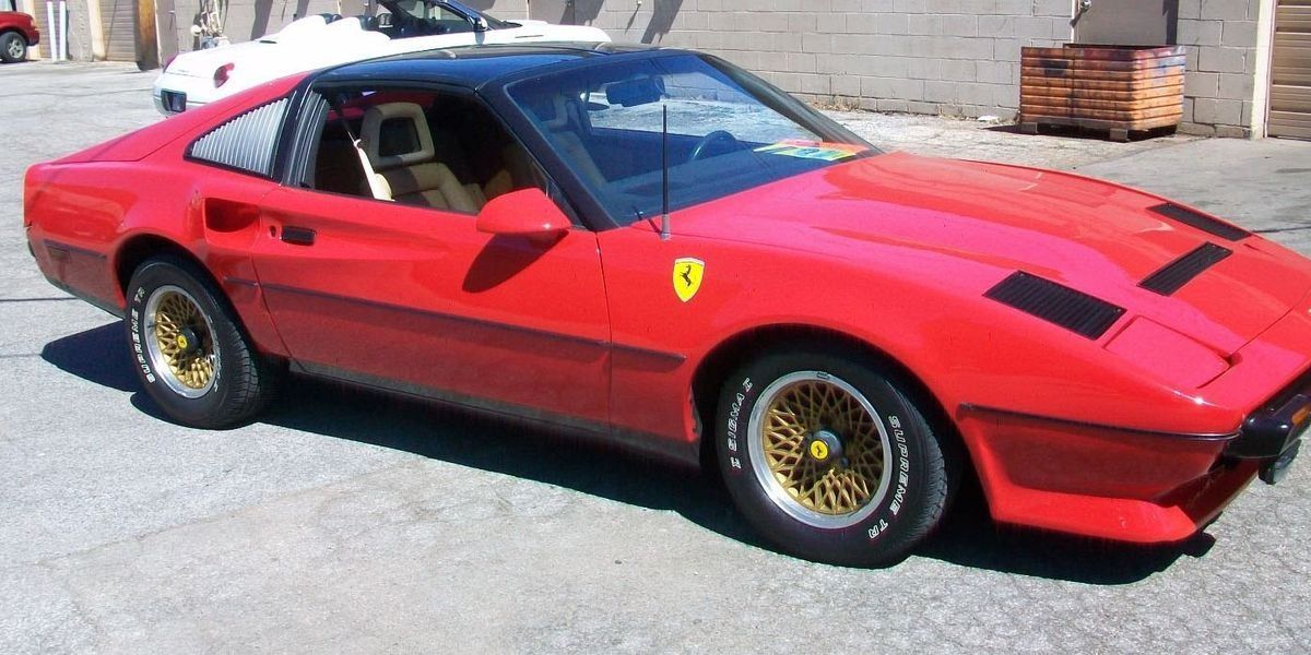 A Pontiac Firebird in the make of a Ferrari 308 parked in a parking lot