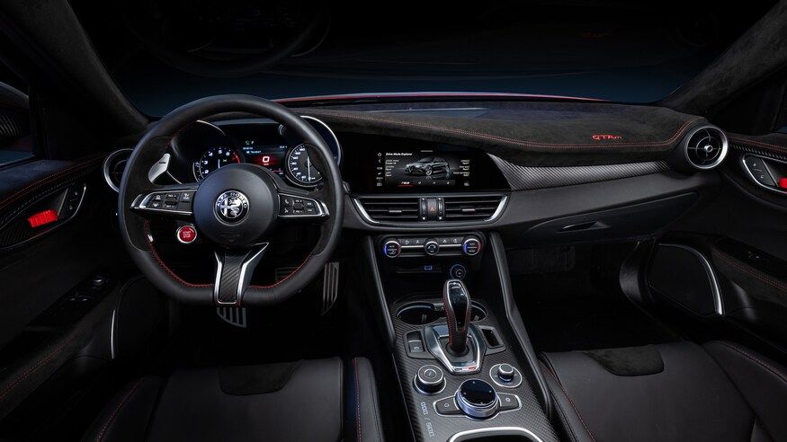 A photo of the wheel and driver's seat of a 2021 Alfa Romeo GTV.