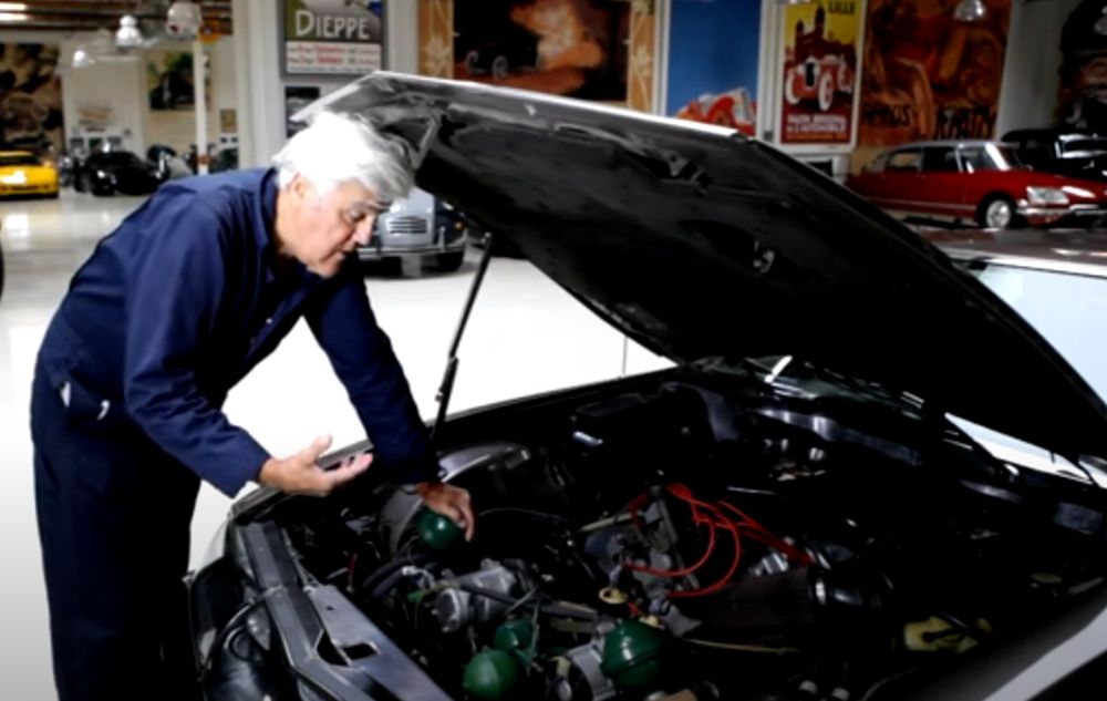 Jay Leno shows the engine of the 1972 Citroen SM