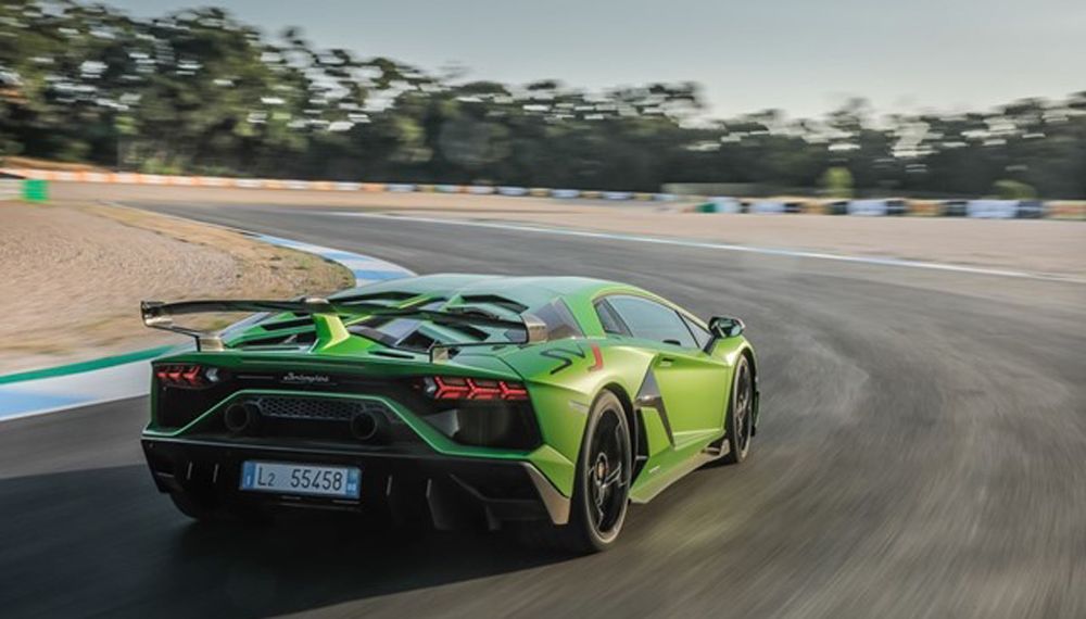 Green Lamborghini Aventador on track