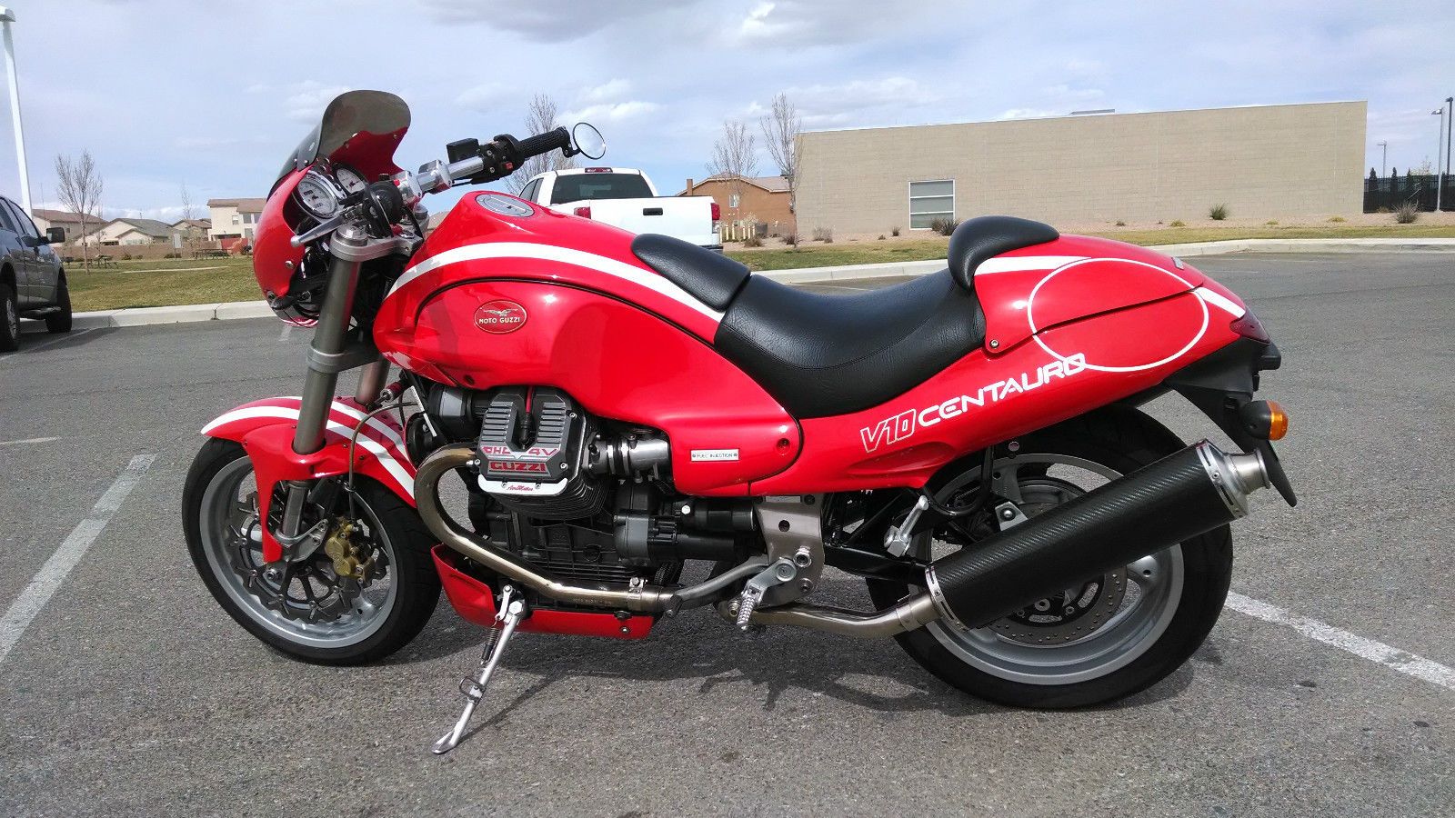 red Moto Guzzi Centauro parked in the middle of the road