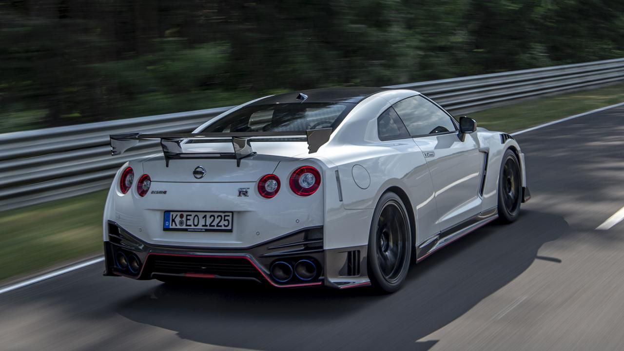 Pearl White Tricoat Nissan GT-R Nismo speeding on the track