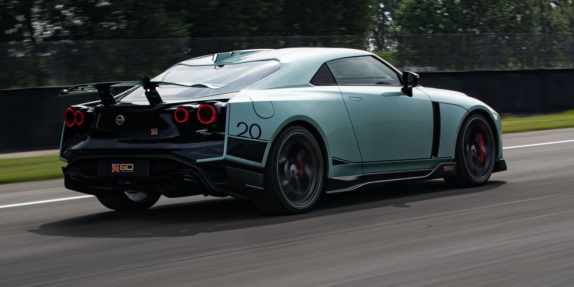 A teal GT-R50 on the track
