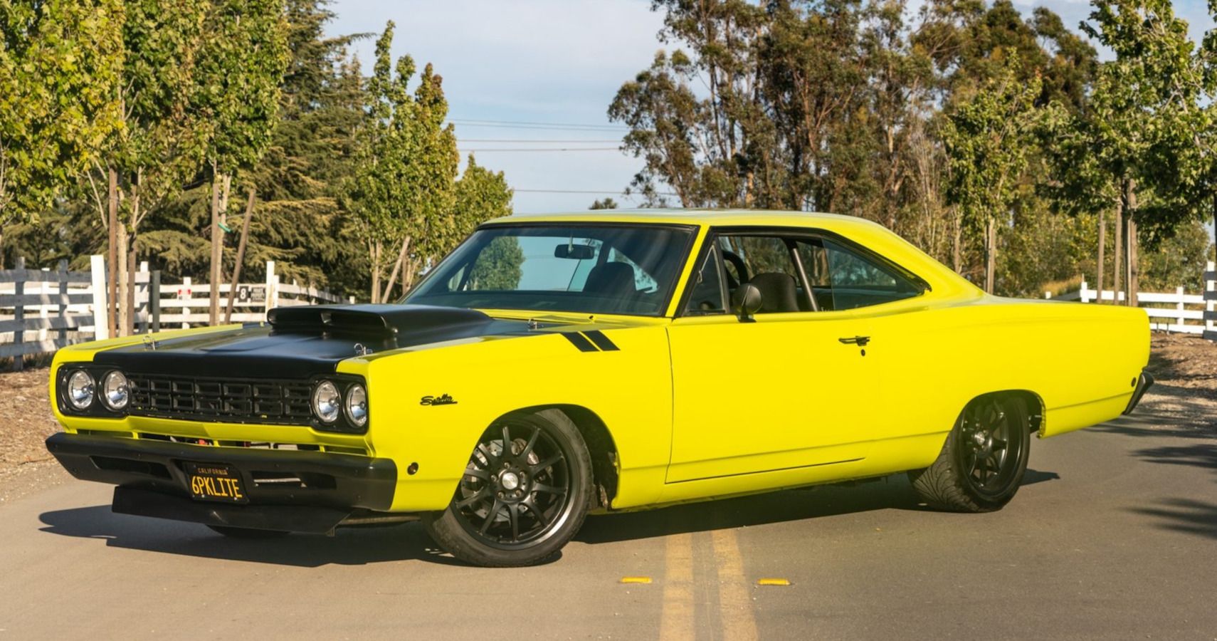Light lime green 1968 Plymouth Satellite in road