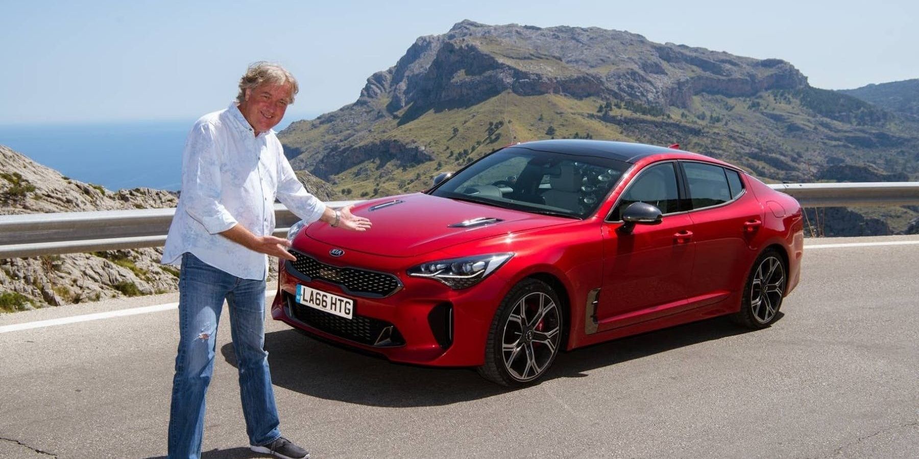 James May with a Kia Stinger GT parked on the road