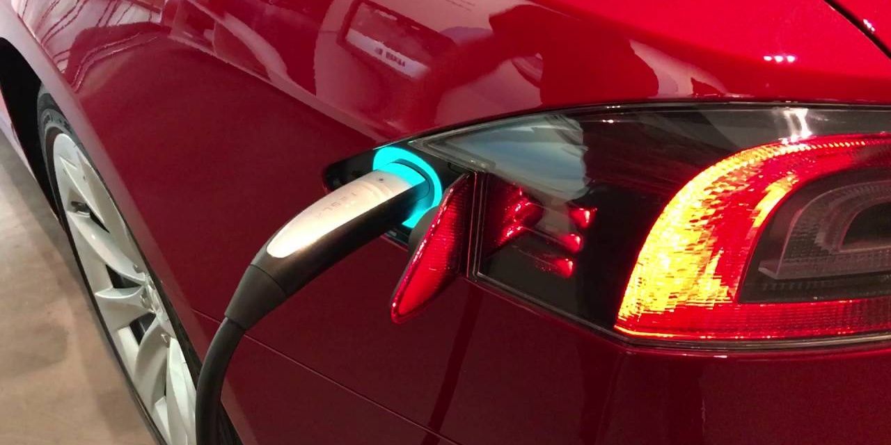 Red Tesla Model 3 Charging port easter egg rainbow
