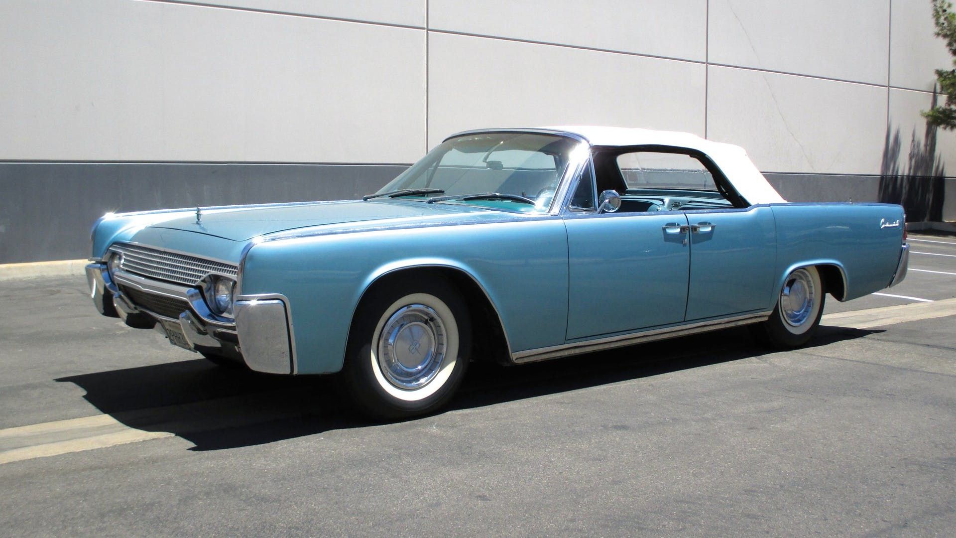 Blue 1961 Lincoln Continental Parked Outside