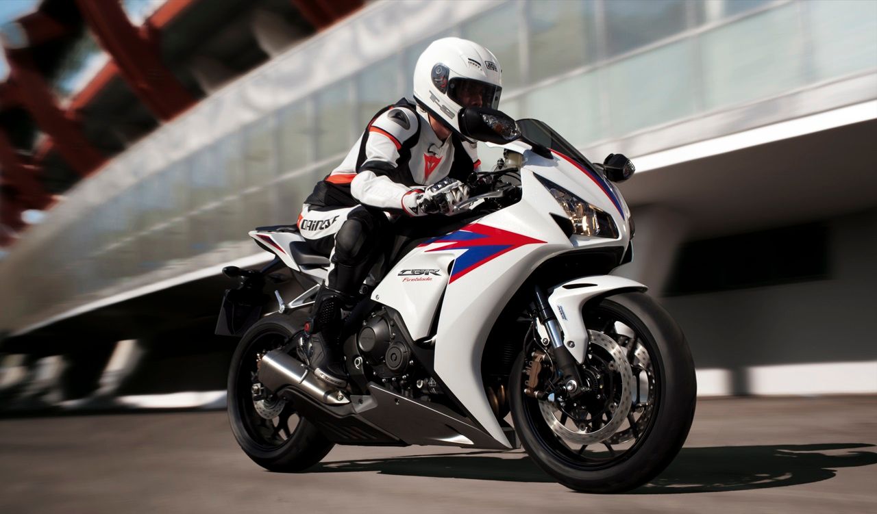 White 2014 CBR1000RR Fireblade riding