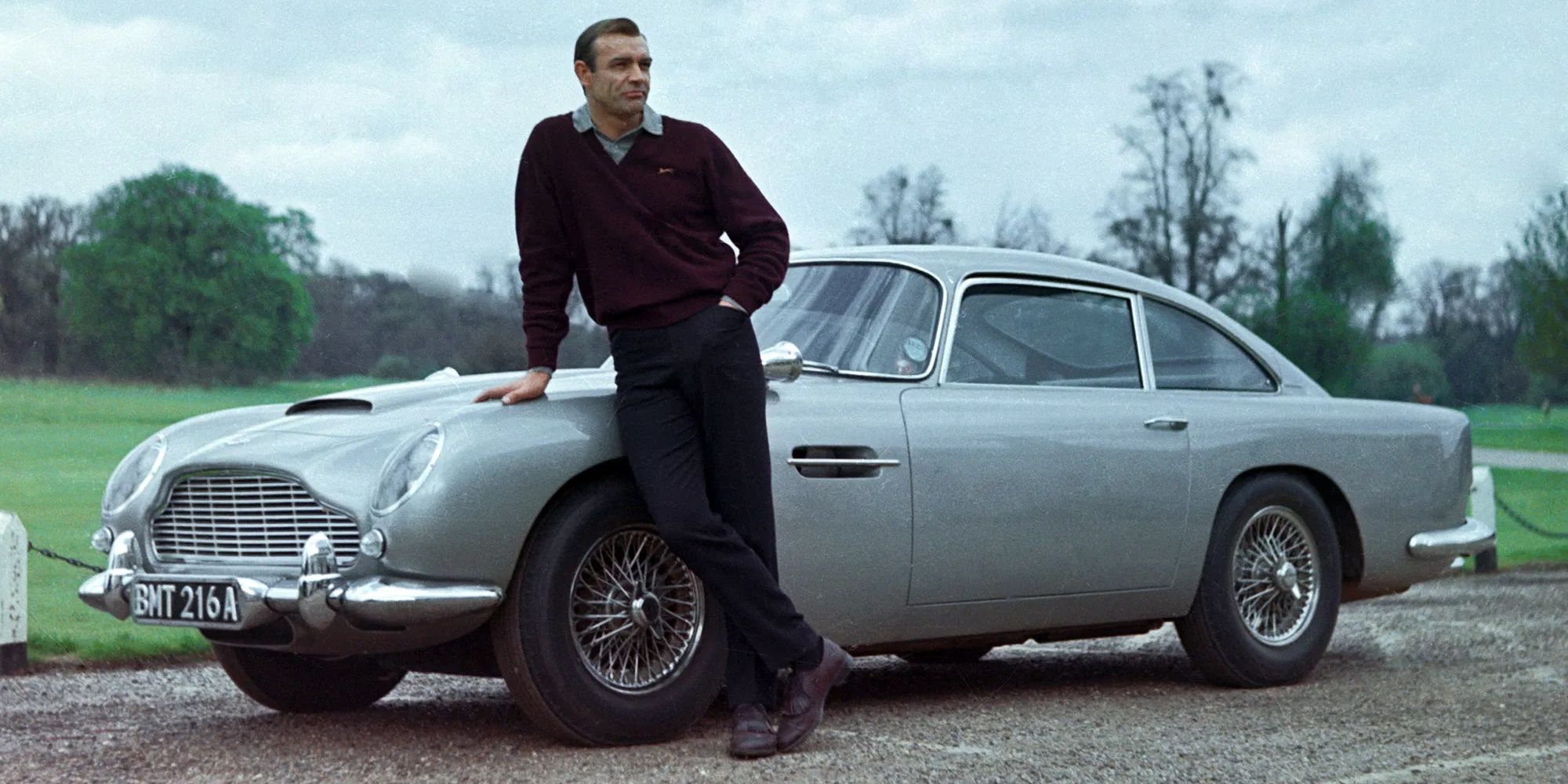 Sean Connery leaning on the DB5