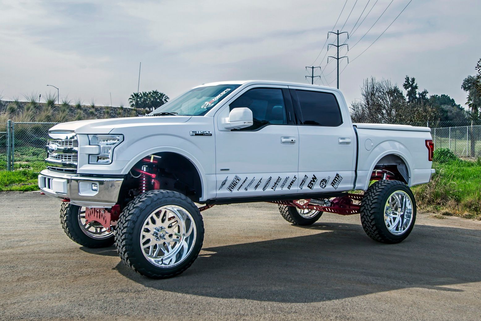 White pickup truck with a suspension lift