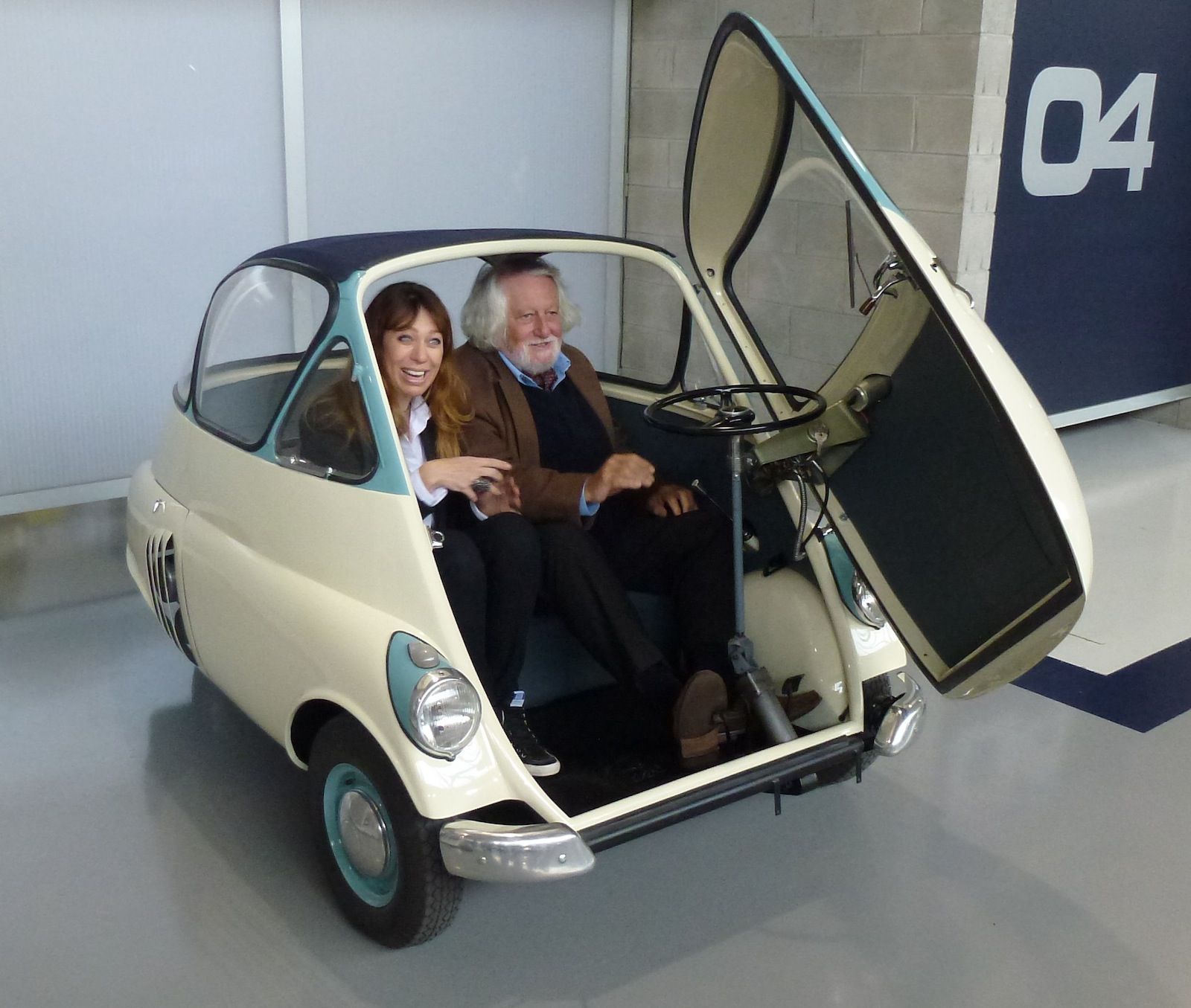 two people in an ISO Isetta