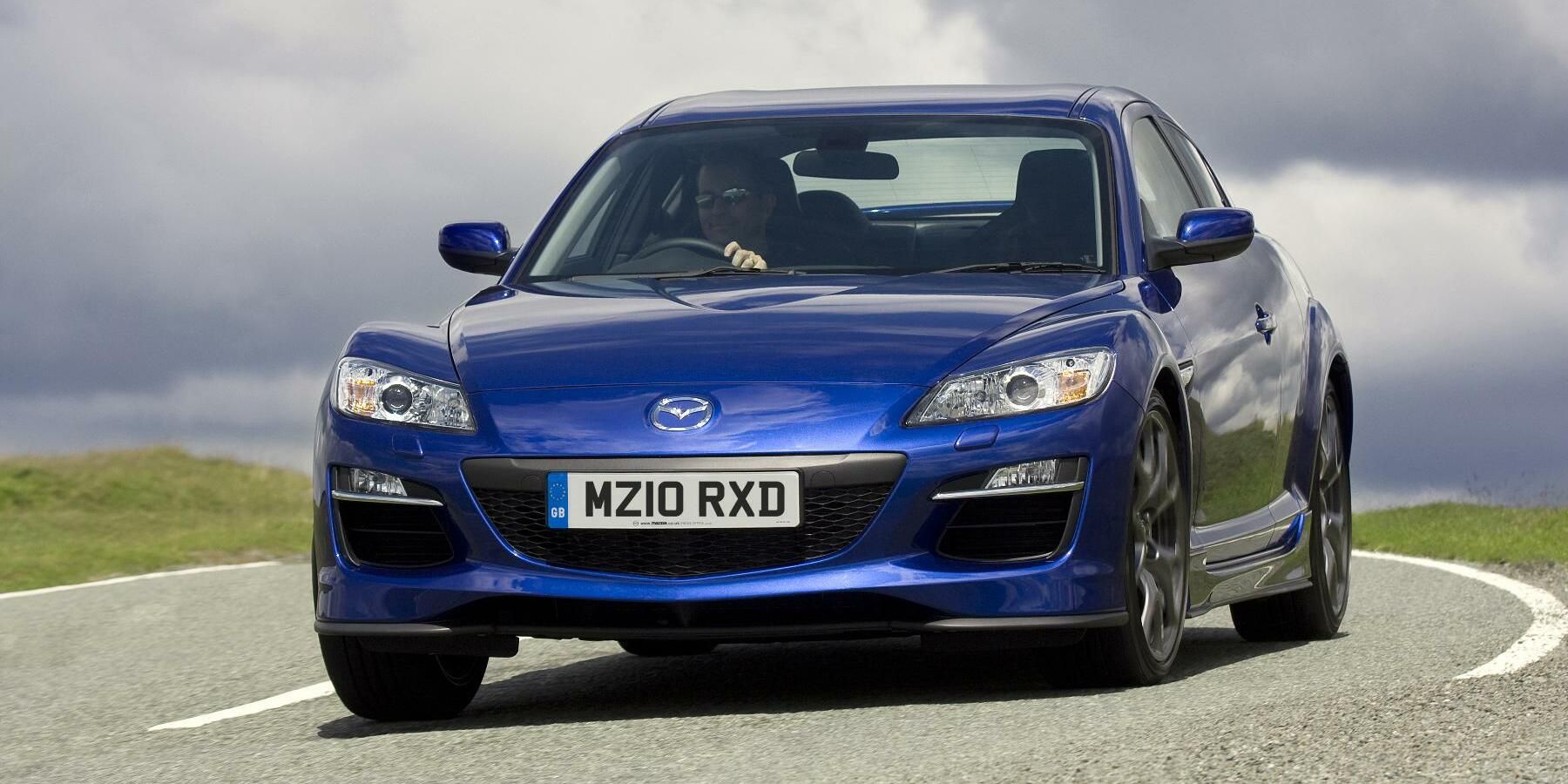 Blue Maxda RX-8 on the road - front