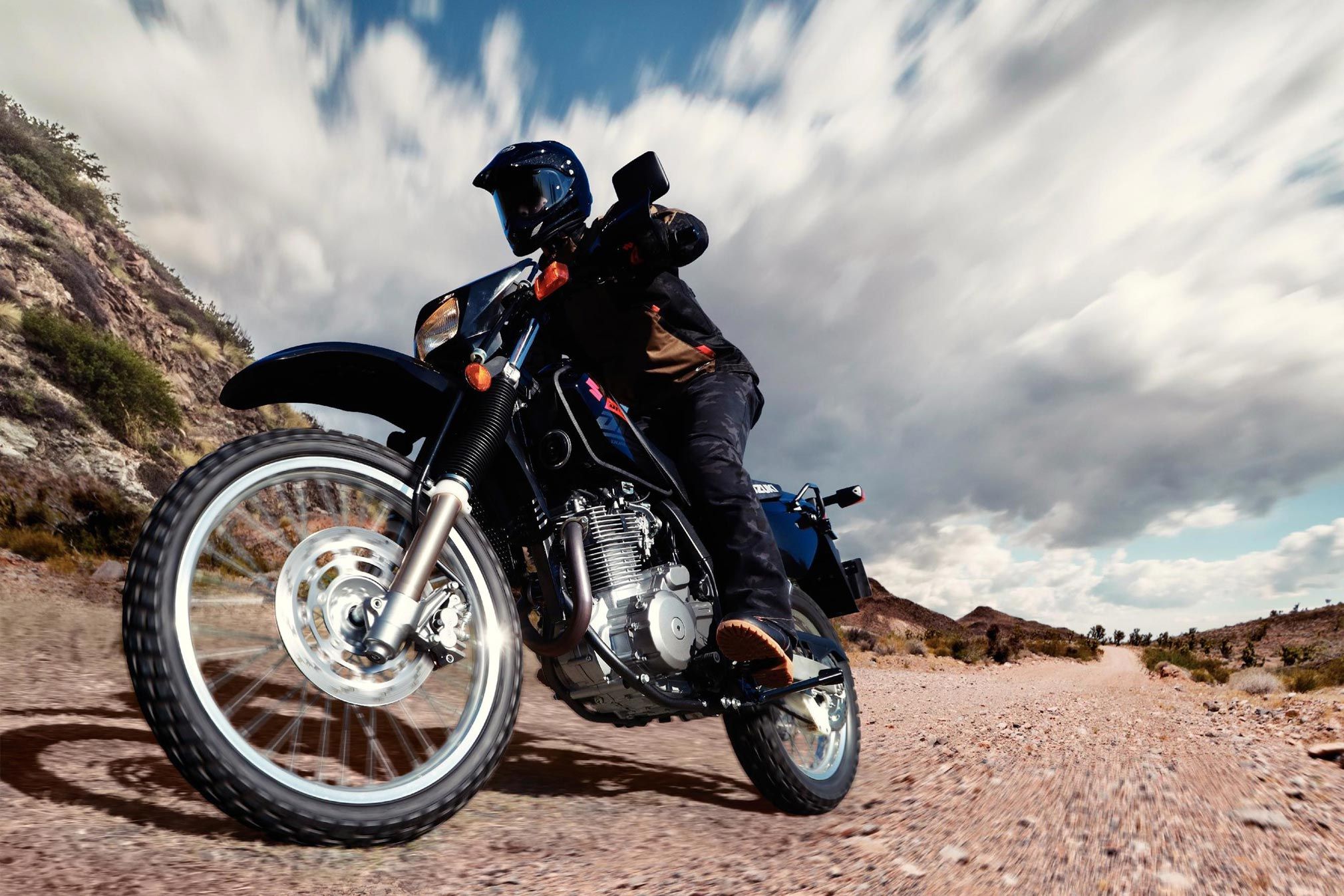 on a dirt road with a Suzuki DR650S