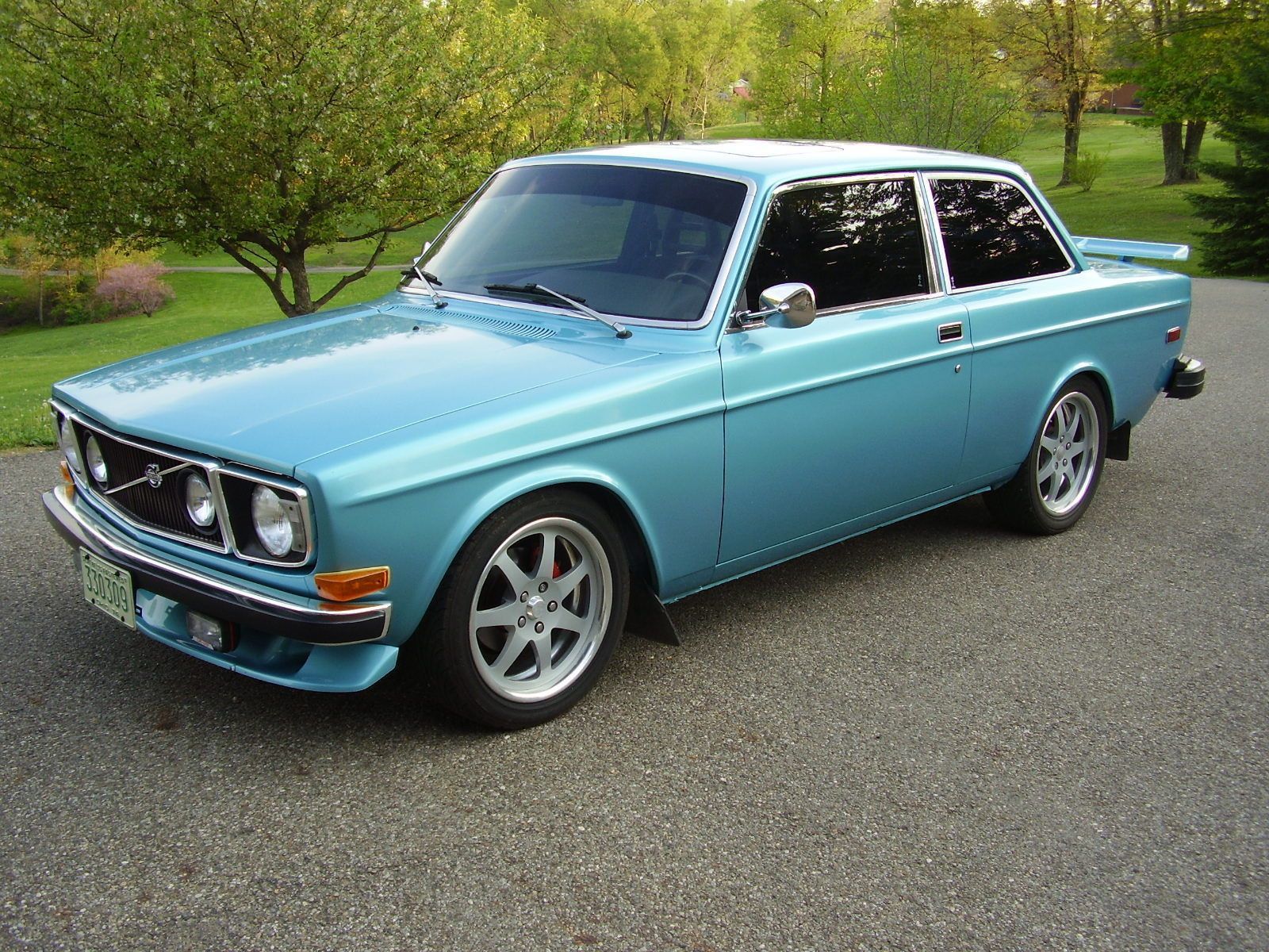 blue Volvo 142, angled front view