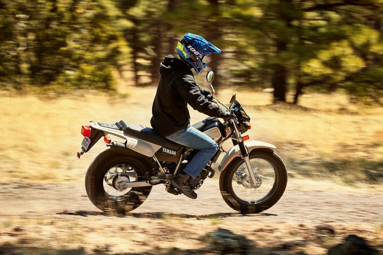 riding on a dirt trail with Yamaha TW200