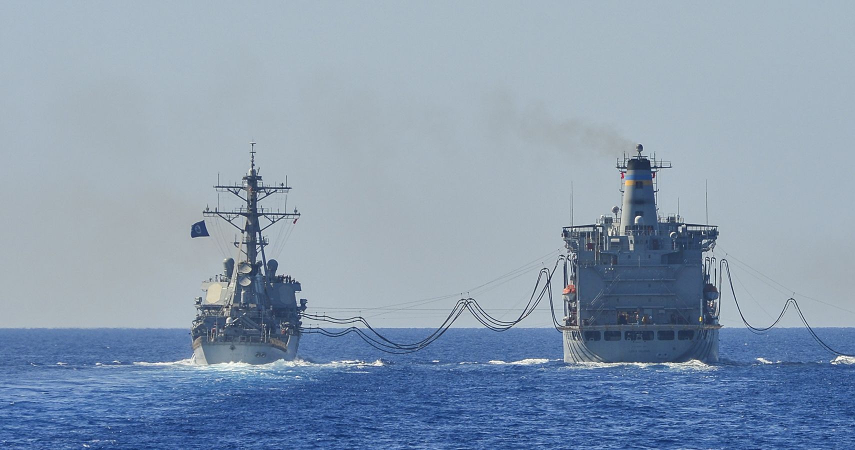 USS Stout (DDG 55) conduct a replenishment-at-sea with oiler USNS Leroy Grumman (T-AO 195)