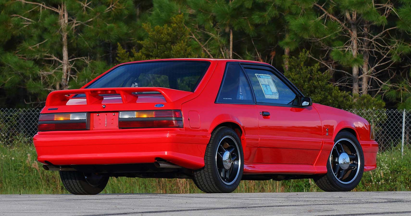 Red Fox Body Mustang on the road