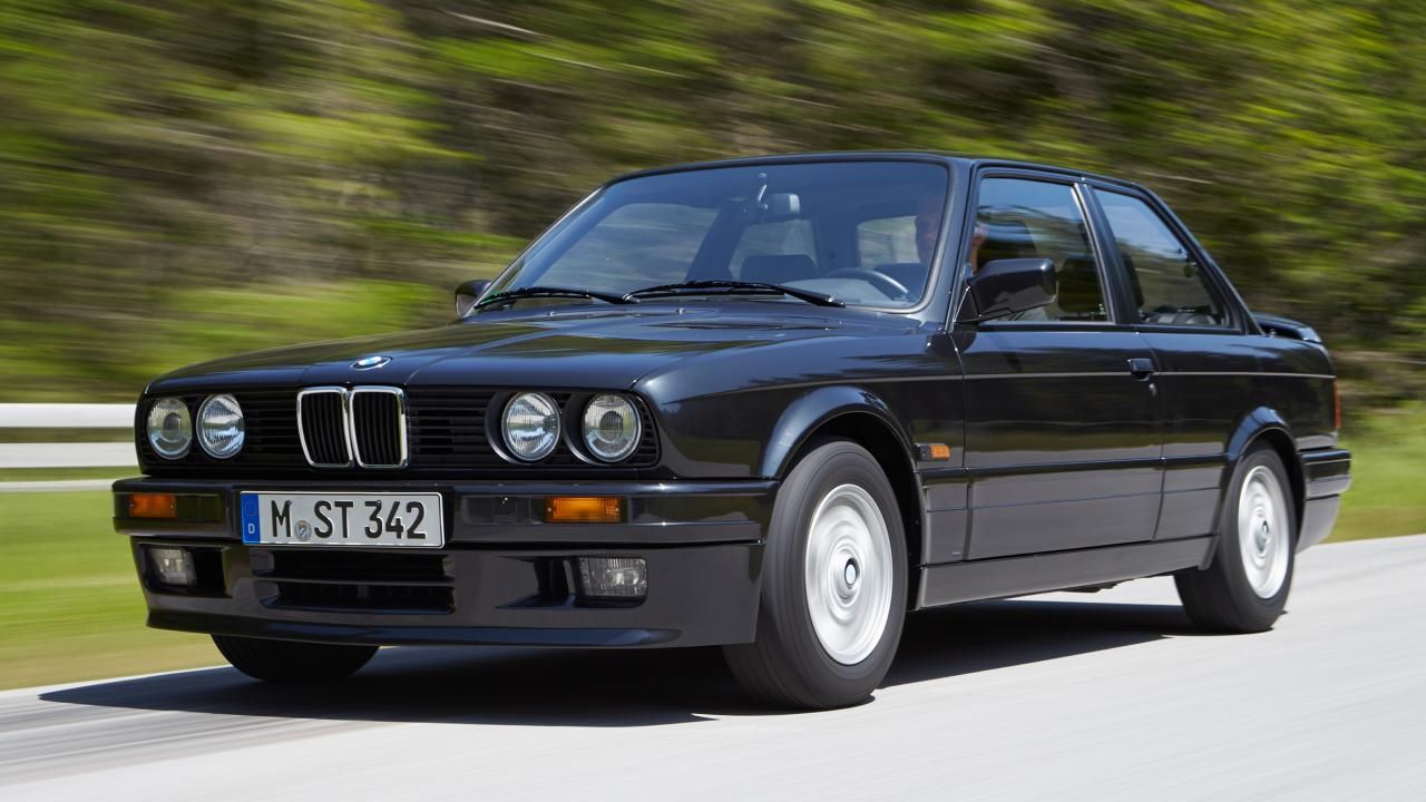 BMW 3-Series (E30) speeding down the road