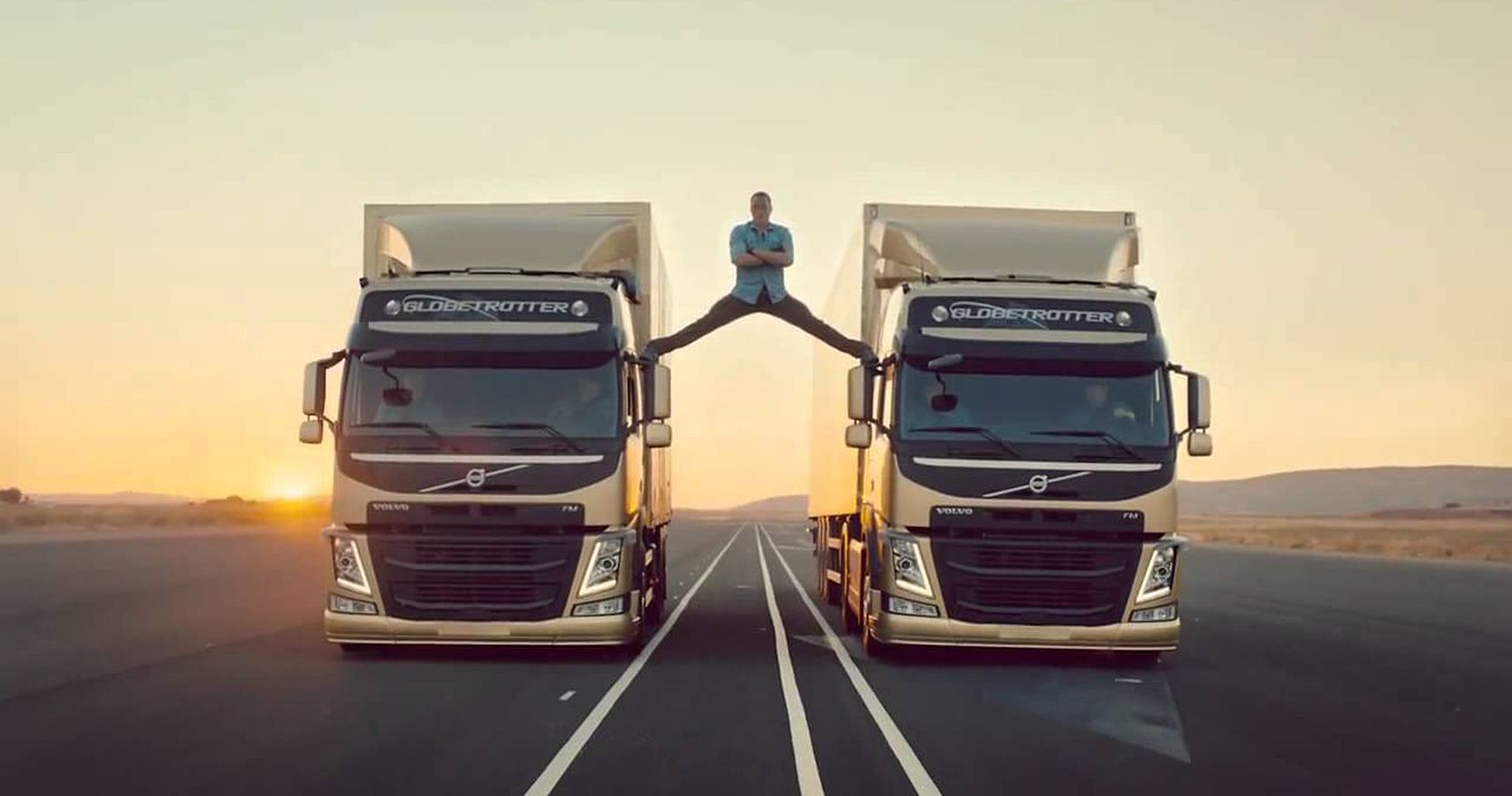 Jean-Claude Van Damme Performed His Trademark Split Between Two Moving, Reversing Volvos, His Feet Resting On The Rearview Mirror