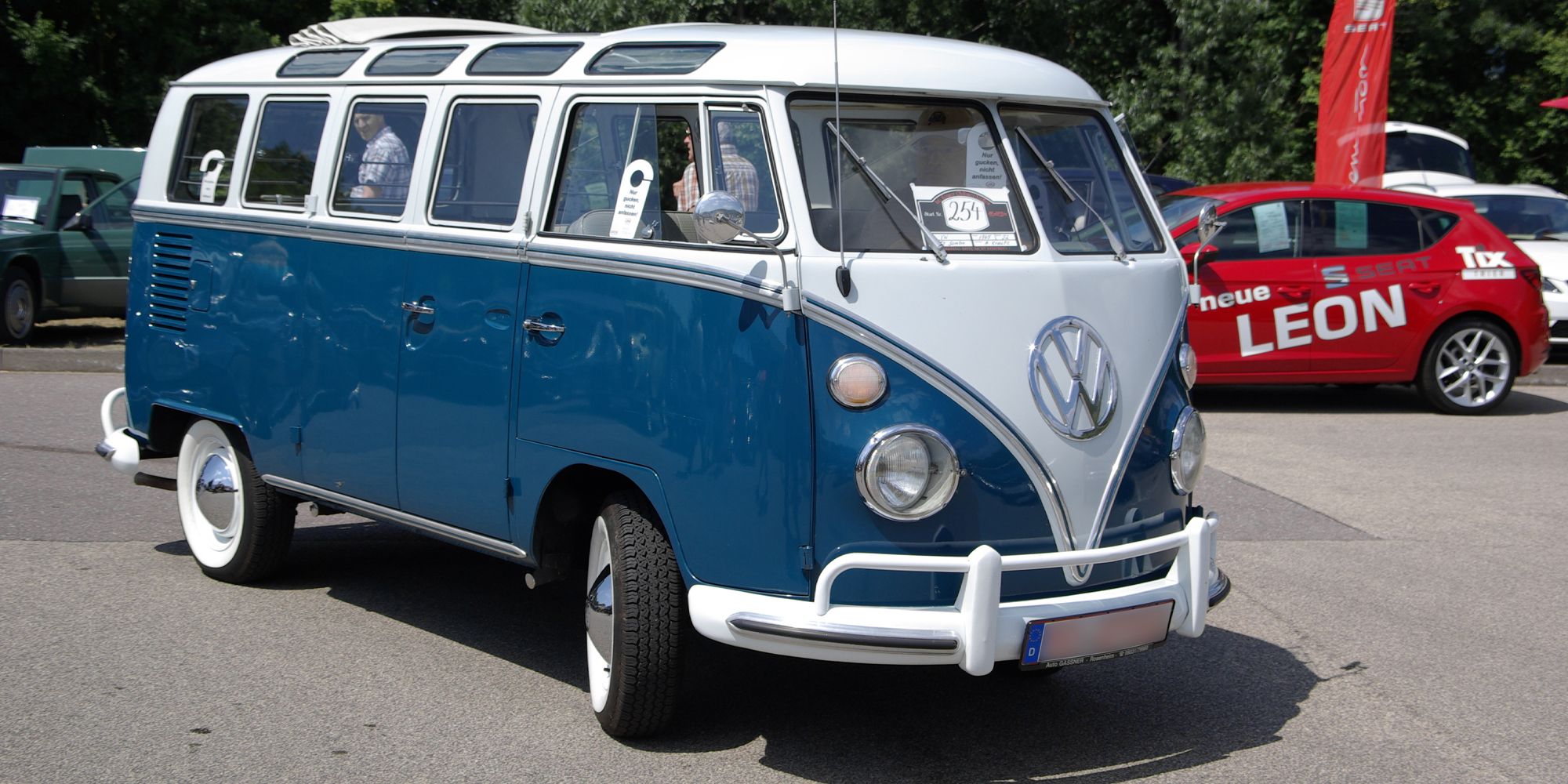 A two tone blue and white Bus