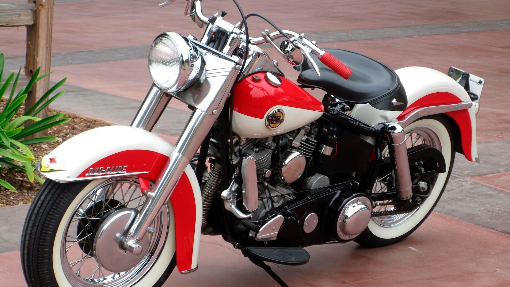 1958 Harley Davidson Duo-Glide parked outside