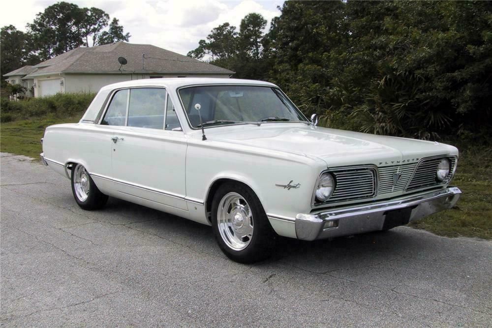 White 1966 Plymouth Valiant on the road