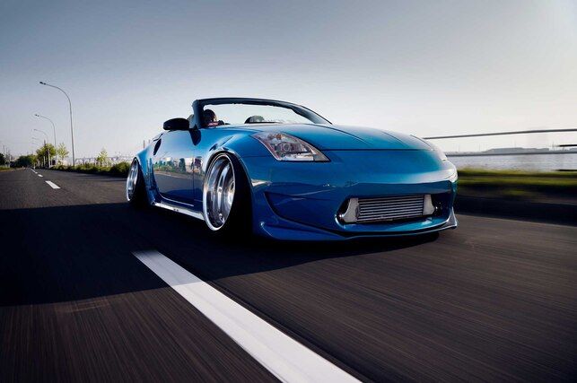 stanced 2002 Nissan 350Z on the highway