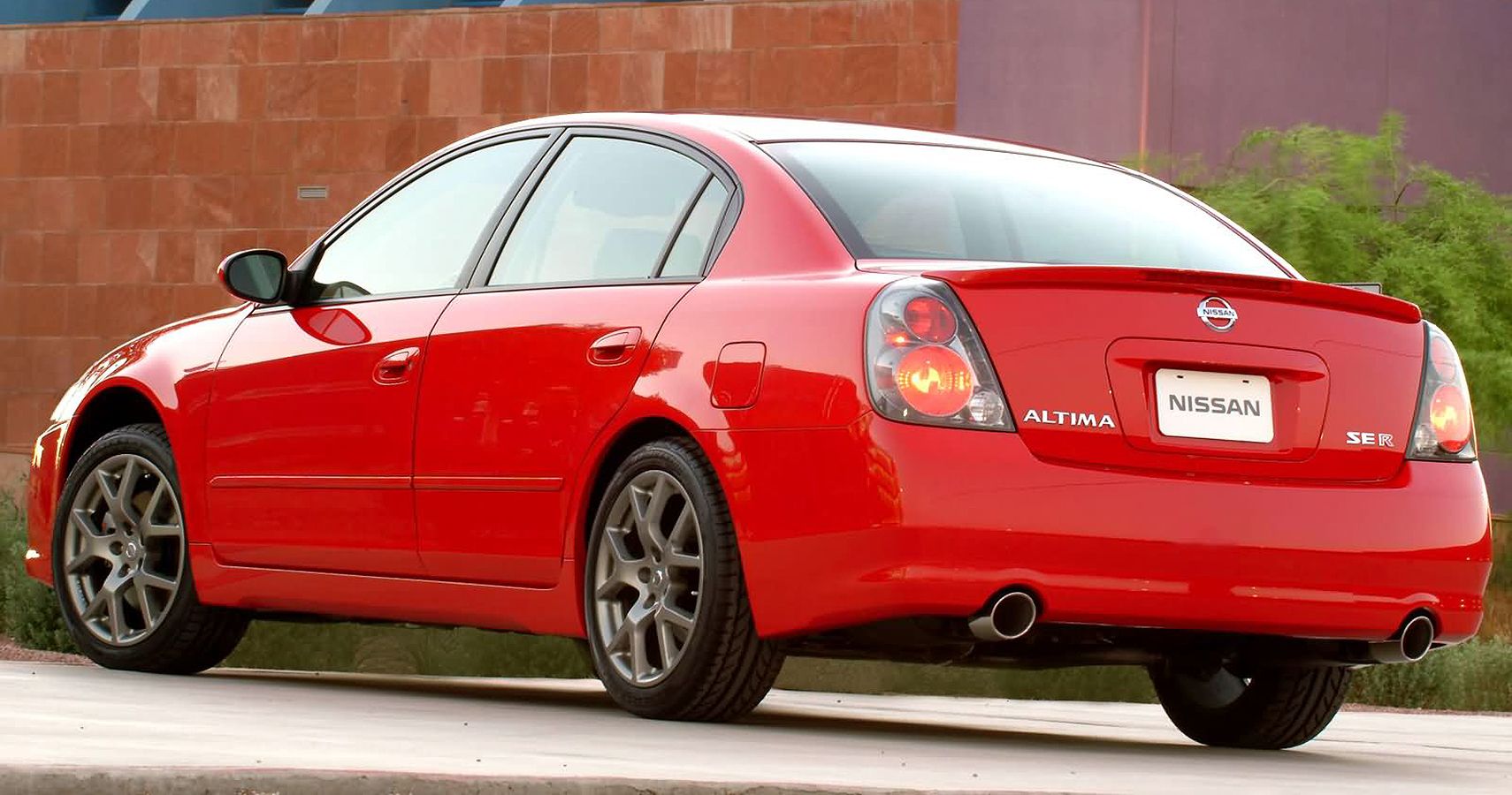 Red 2005 Nissan Altima Parked