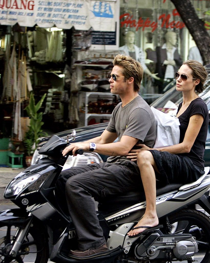 Angelina Jolie with Brad on a bike