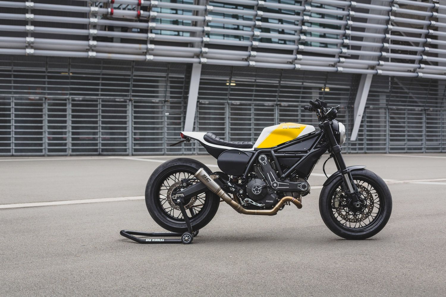 a motorcycle transformed using the Bad Winners DIY Scrambler Ducati MotoKit.